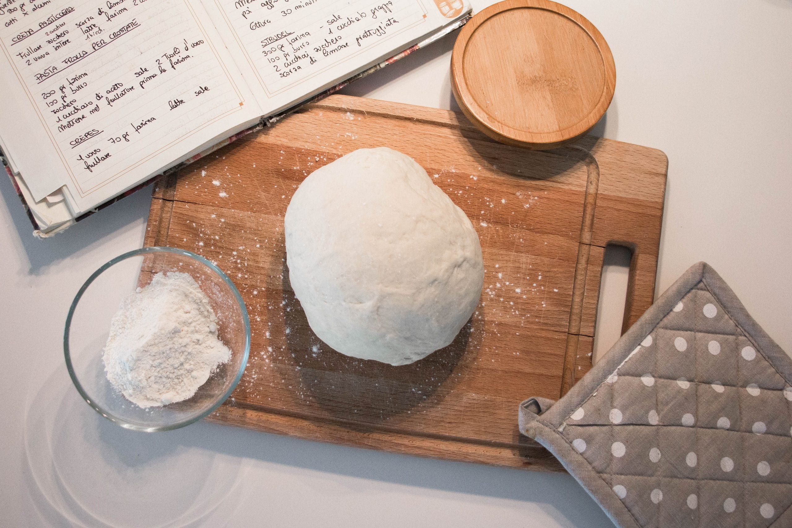 pizza-dough-woodboard press on pizza dough